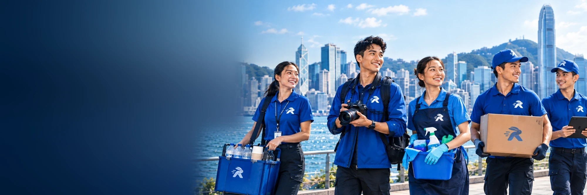 Five RabbitOTG helpers in blue uniforms walk along Hong Kong's harbour carrying drinks, a camera, cleaning supplies and a parcel