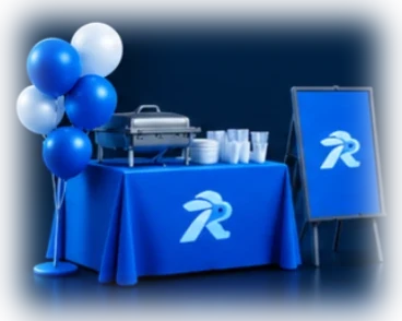 Blue event table with balloons, serving trays and a rabbit sign